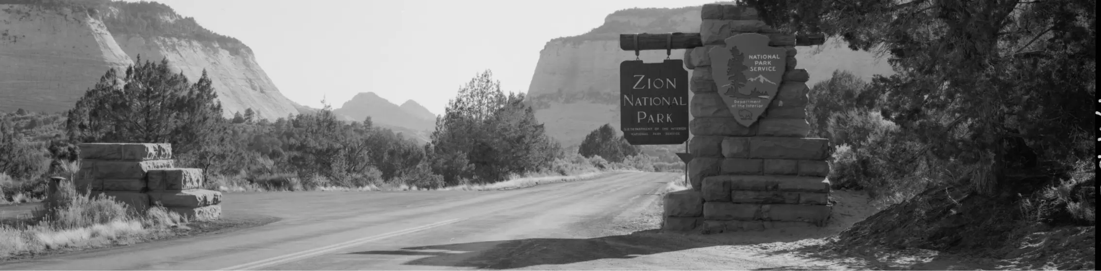 entry way to zion national park in black and white