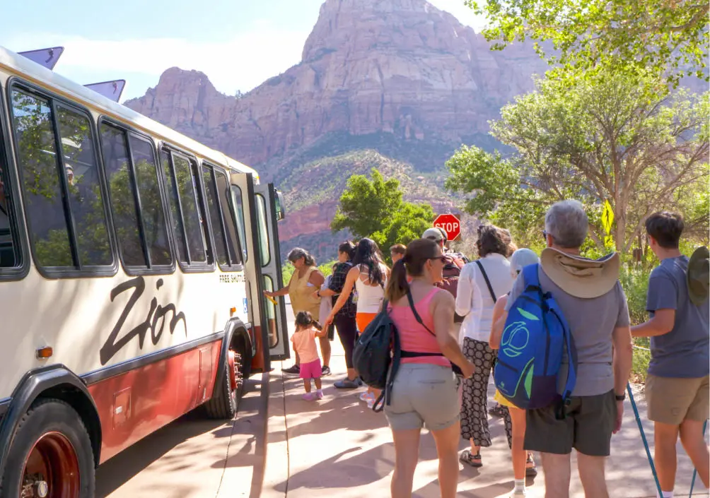 visitors boarding the springdale shuttle