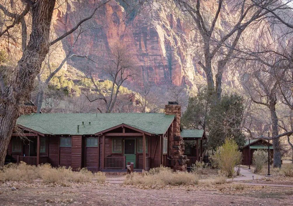 a cabin surrounded by rock formations at zion