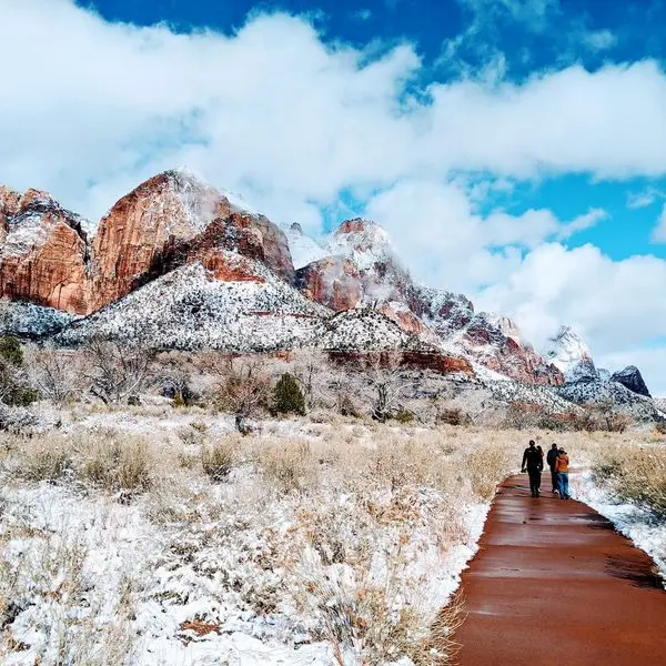 winter hikers on a path at zion